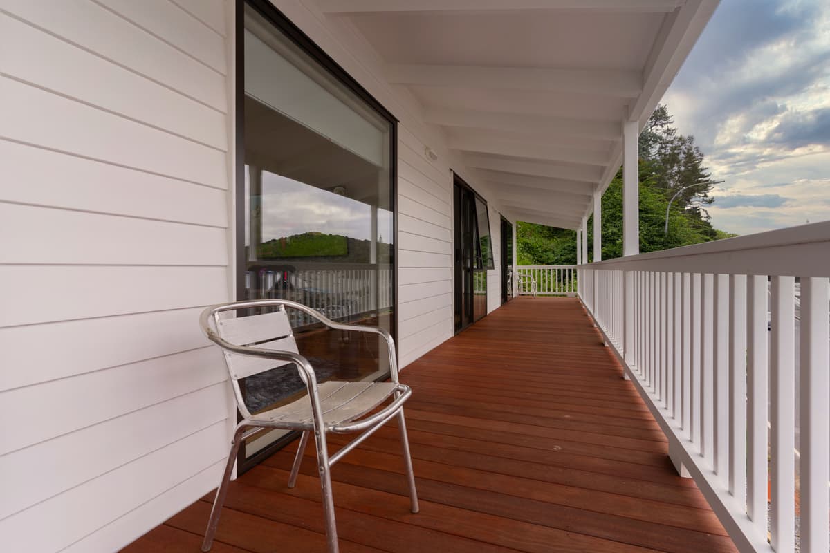 Timber verandah deck with a white balustrade, carpentry for homes across Logan City
