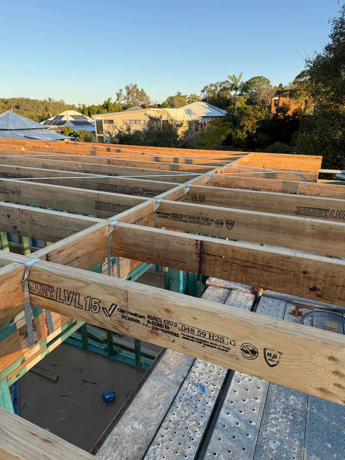 LVL floor framing with steel strapping on a new build, framed by Hogan Projects